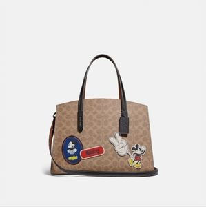 Disney X Coach Charlie Carryall In Signature Canvas With Patches